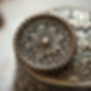 Elegantly Adorned Metal Box Lid Close-up view of a finely crafted metal box lid adorned with elegant motifs