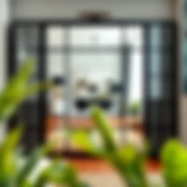 A stylish black industrial mirror reflecting an elegant room setting