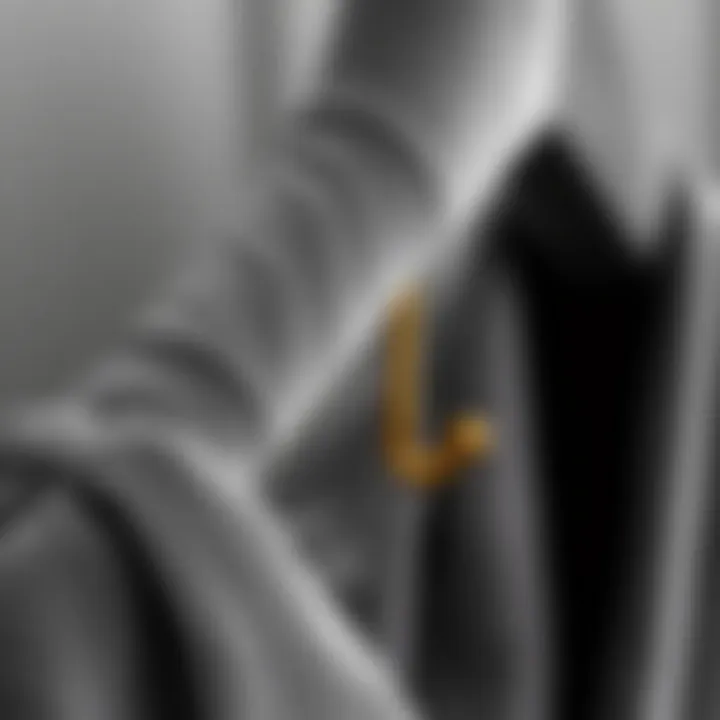 Close-up of grey velvet hanger showcasing its texture and gold hook detail